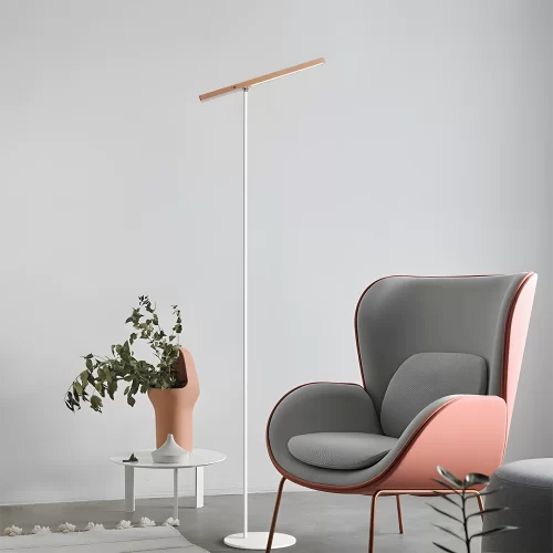 Beech Wood Portable Modern Reading Floor Lamp stands elegantly beside the pink sofa.