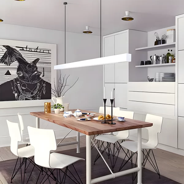 A white pendant light hangs from the ceiling above a square wooden dining table in a modern-style home.