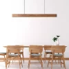 The meeting room is embellished with a high power linear walnut pendant light.