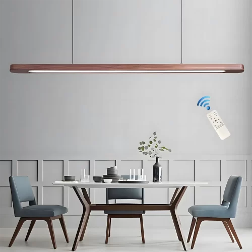 A white dining table with three blue chairs around it, with a remote-controlled oval walnut, LED pendant light hanging above.