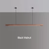 A black walnut pendant light is installed on the ceiling using a circular canopy, cables, and steel wires.