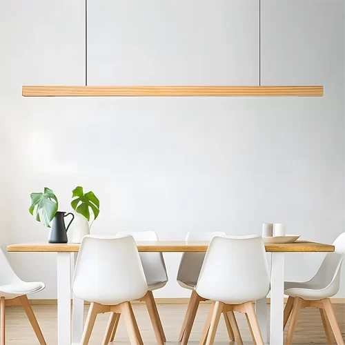 A pine wood pendant light hangs above a dining table surrounded by six chairs.