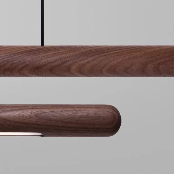 Displaying the wood grain at the center and ends of a round rod walnut chandelier.