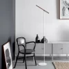 Walnut Wood Portable Modern Reading Floor Lamp stands gracefully in the corner of the room.