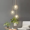 Glass Ball Pendant Light hangs elegantly in the corner of the bedroom and emits a warm and cozy light.