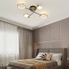 Gold 4 Heads Modern Aluminum Rings Frame LED Ceiling Pendant hangs from the bedroom's ceiling.