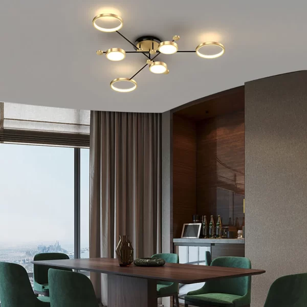 Gold 6 Heads Modern Aluminum Rings Frame LED Ceiling Pendant hangs from the dining room's ceiling.