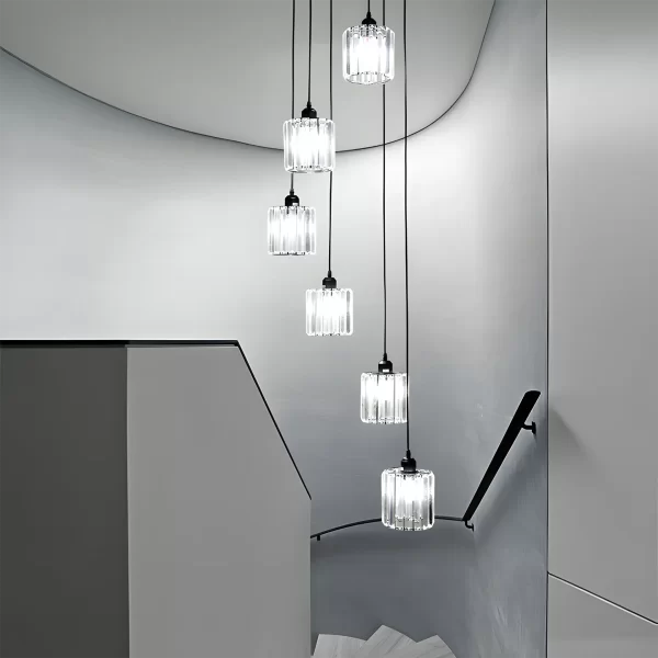 Round Modern Crystal Chandelier hangs above the ceiling at the staircase and emits an elegant white light.