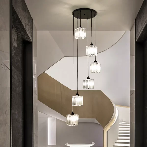 Square Modern Crystal Chandelier hangs above the ceiling at the hotel's staircase, emitting a warm and cozy glow.