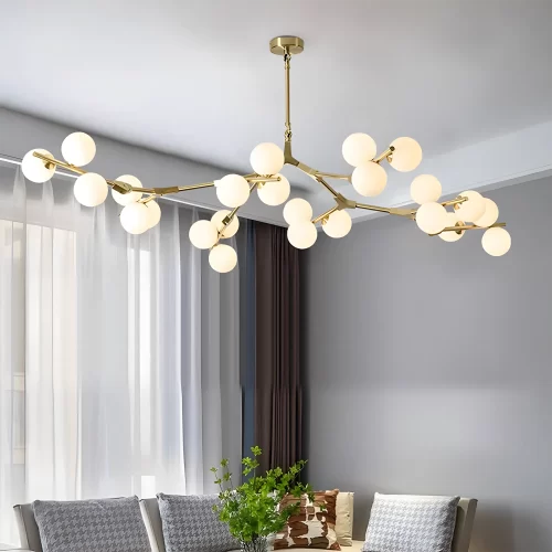 Gold 24 Heads Tree Branch Glass Ball Chandelier hangs elegantly from the living room ceiling.