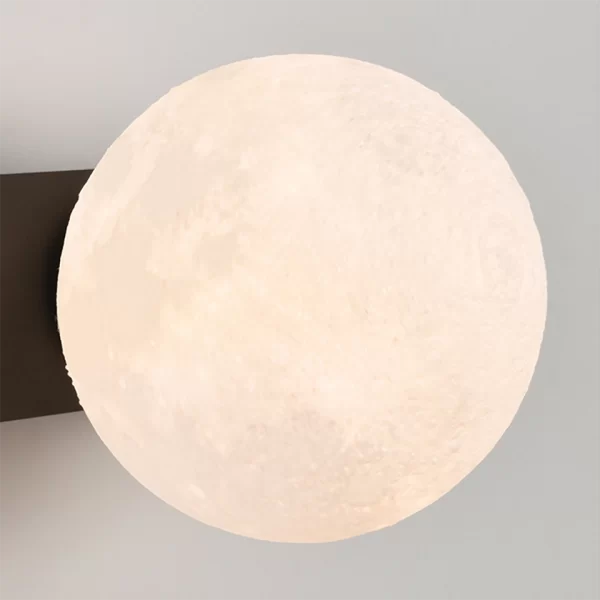 Close up of Modern Minimalist Creative Moon Wall Lamp, showcased the lunar lampshade.