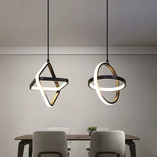 Simple Modern LED Pendant Lights, square and round, hang elegantly above the dining table.